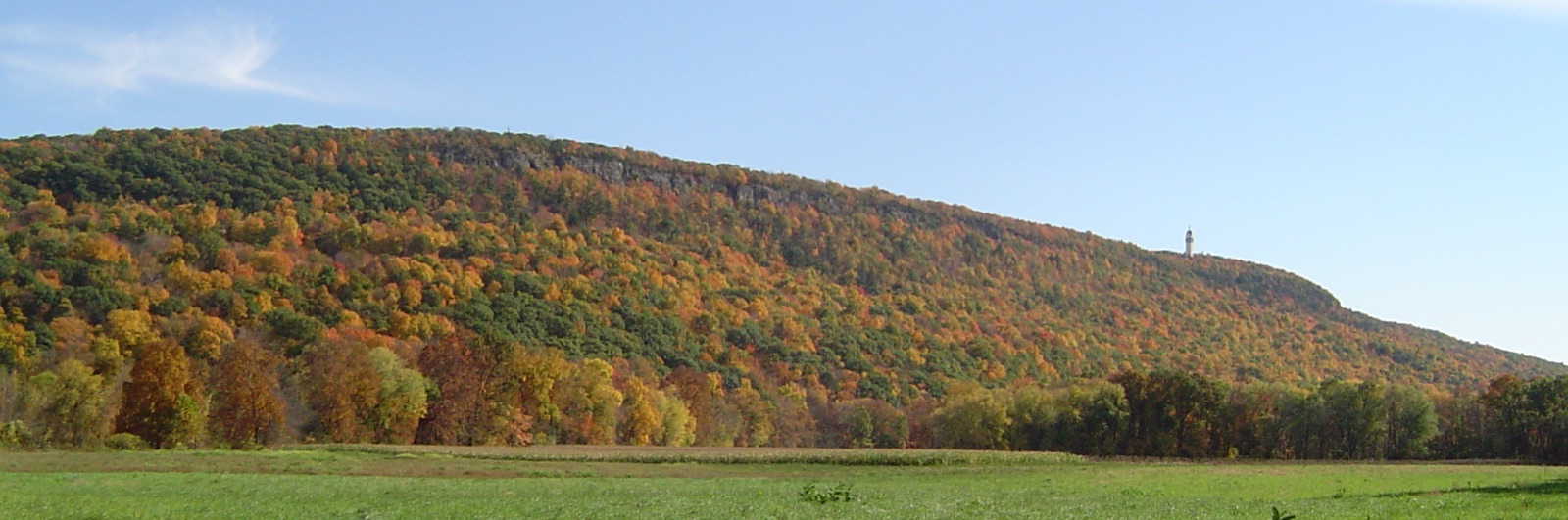 Talcott Mountain in fall color, with Heublein Tower on the ridge above Simsbury, Connecticut
