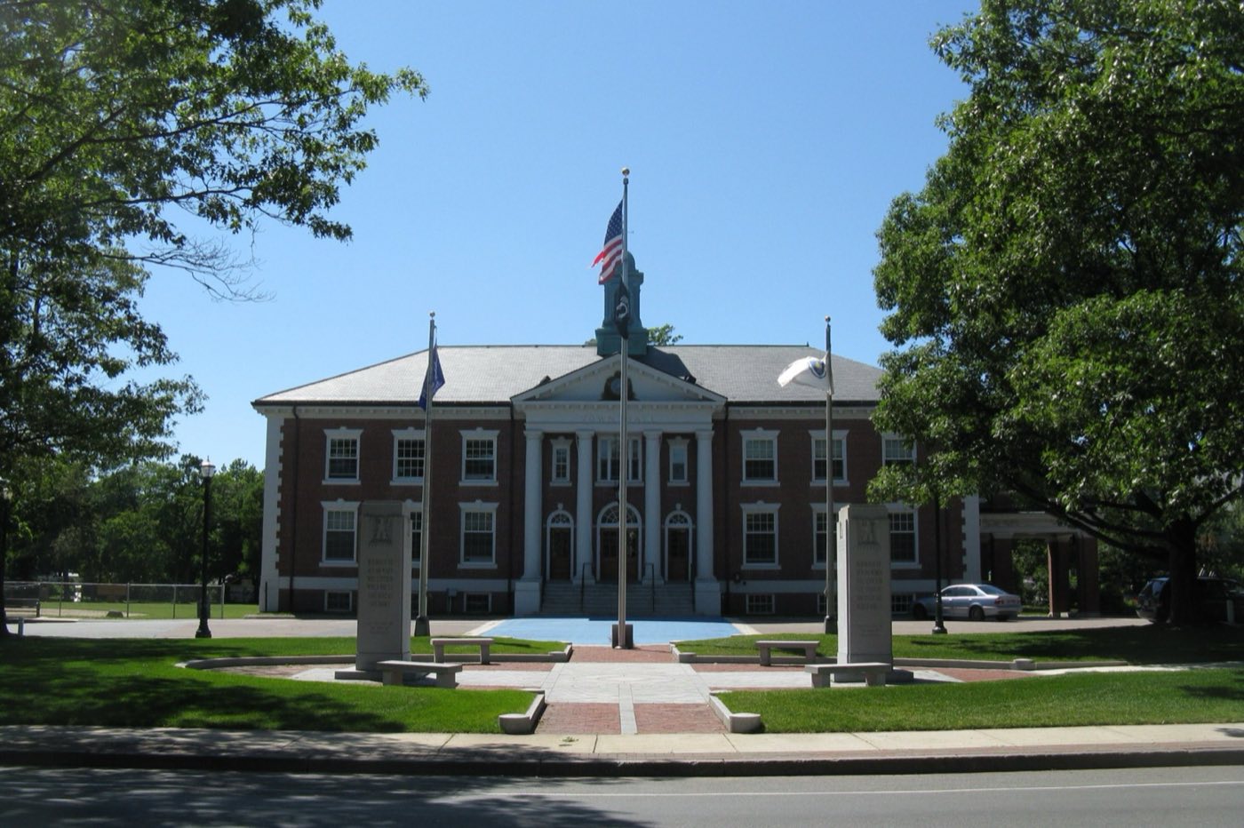 Braintree Town Hall, a brick and white-columned building facing the town common.