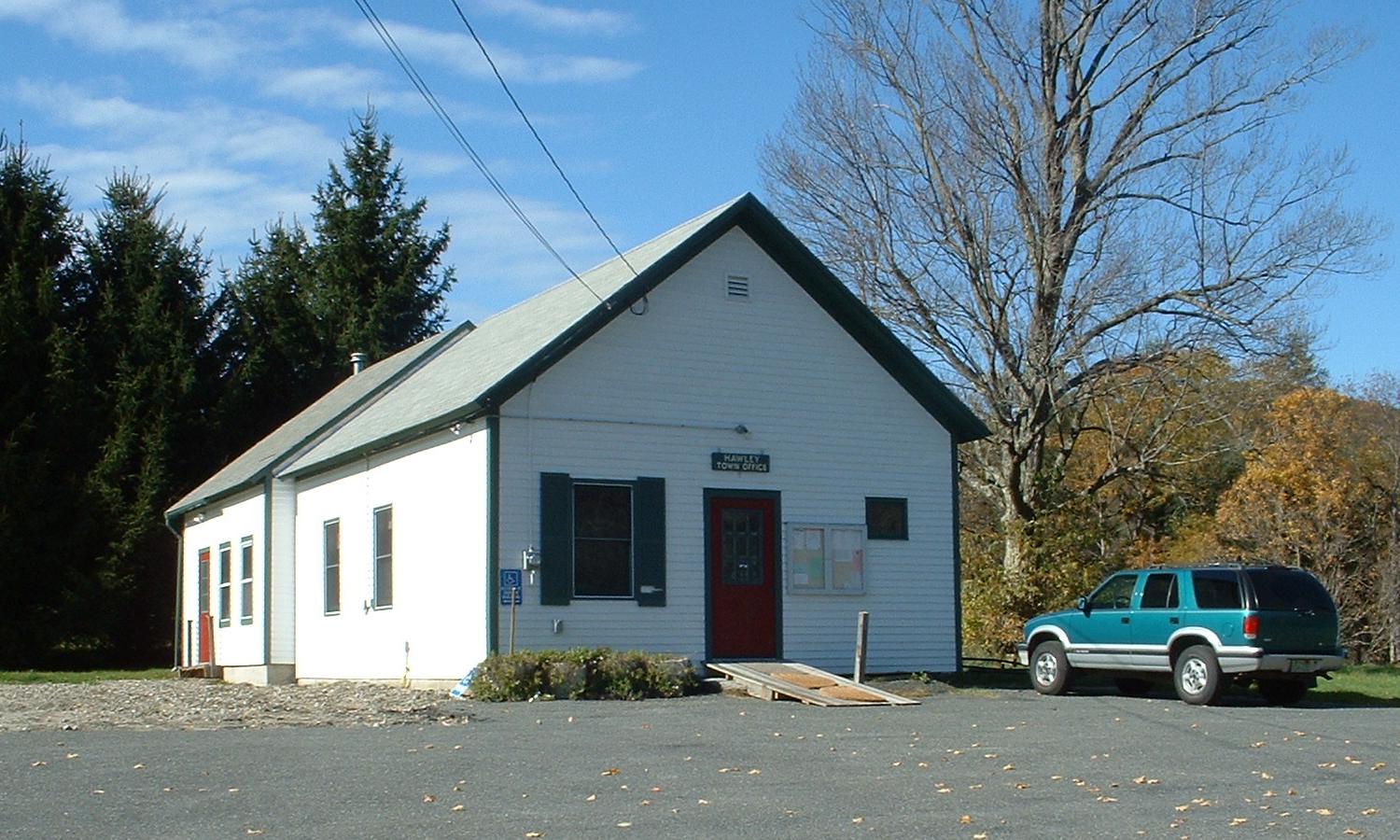 Hawley Town Office, a white one-story clapboard building on Pudding Hollow Road in Hawley, Massachusetts.