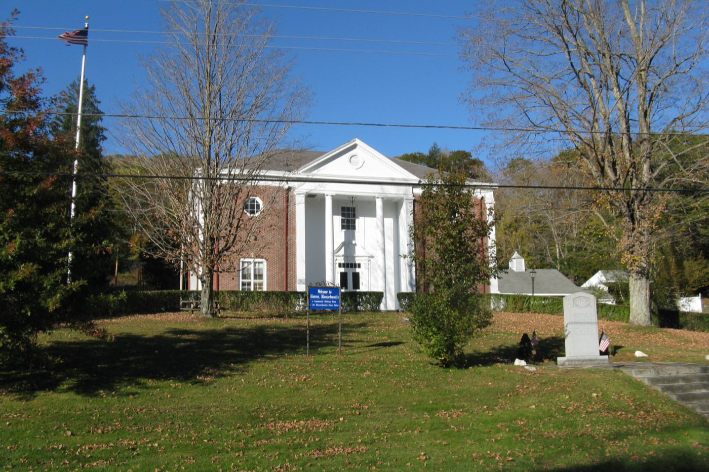 Monroe Town Hall, a brick and white-columned building in Monroe, Massachusetts.