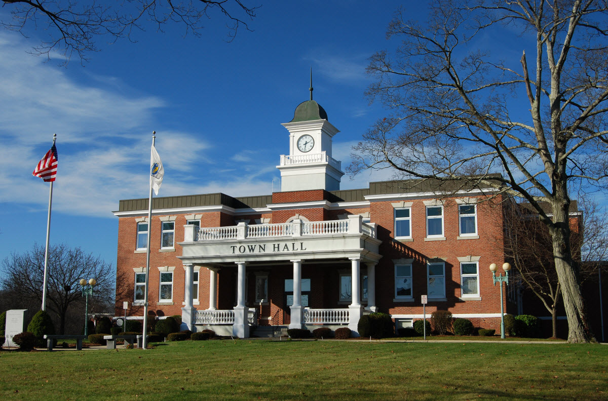 Randolph Town Hall, a brick building with a white clock tower and columned entrance.