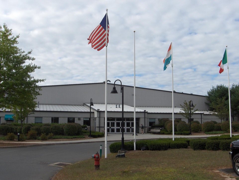 The International Skating Center of Connecticut building with flags out front