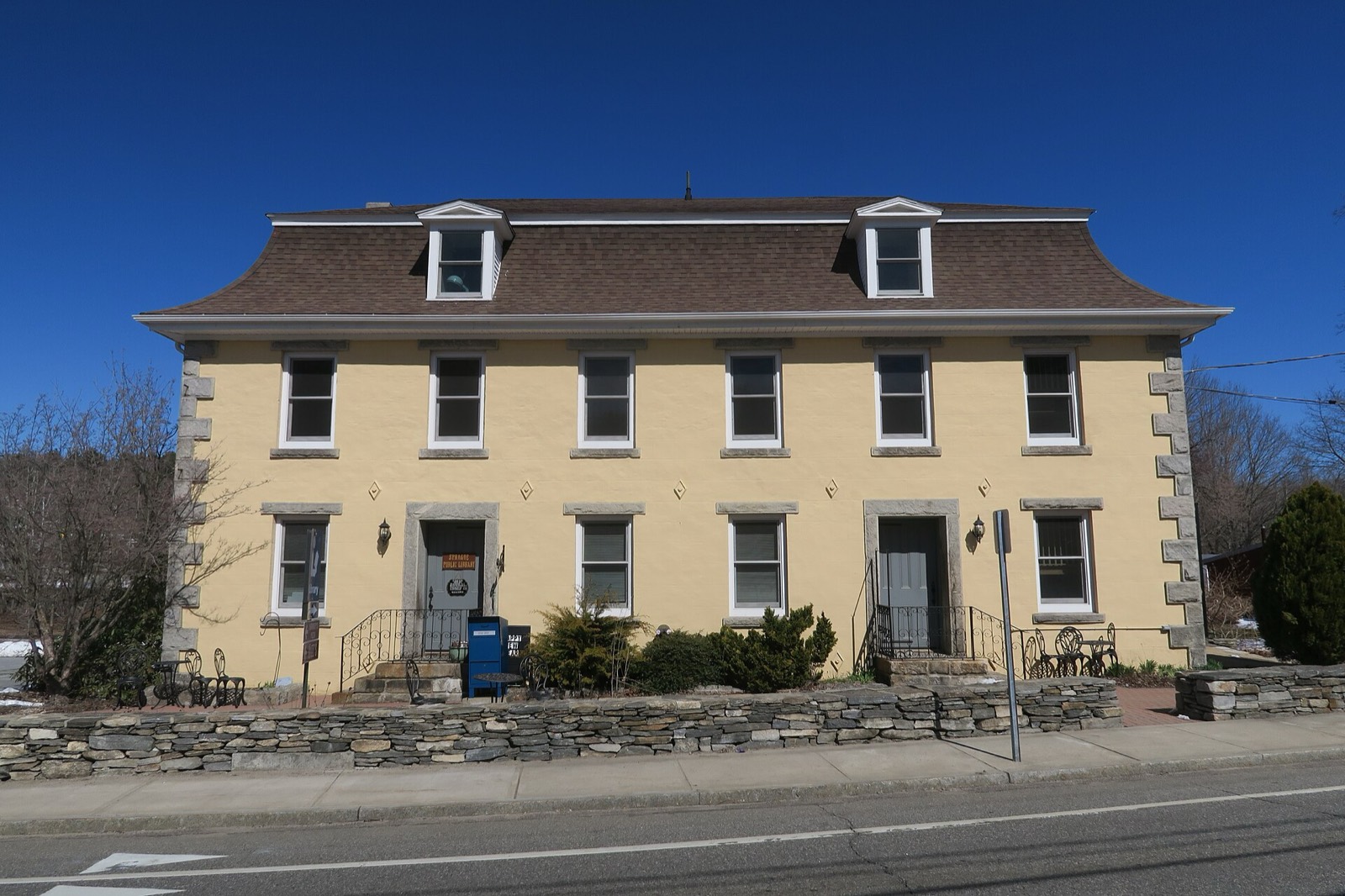 Sprague Public Library, a historic stone mill building in Baltic, Connecticut